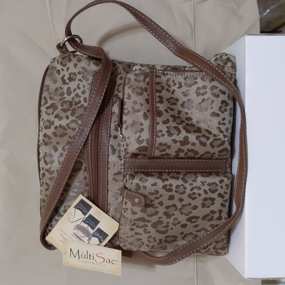 Multi Sac handbag animal print heavy twill woven fabric trimmed in leather.